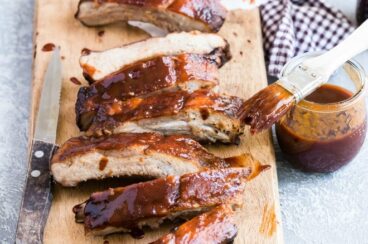 Barbecue ribs on a wood cutting board.