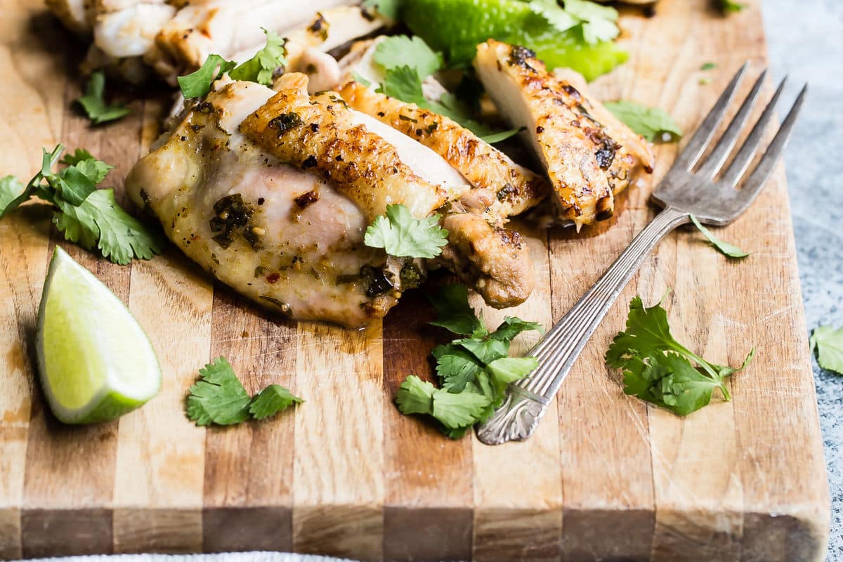 A cutting board full of sliced cilantro-lime chicken