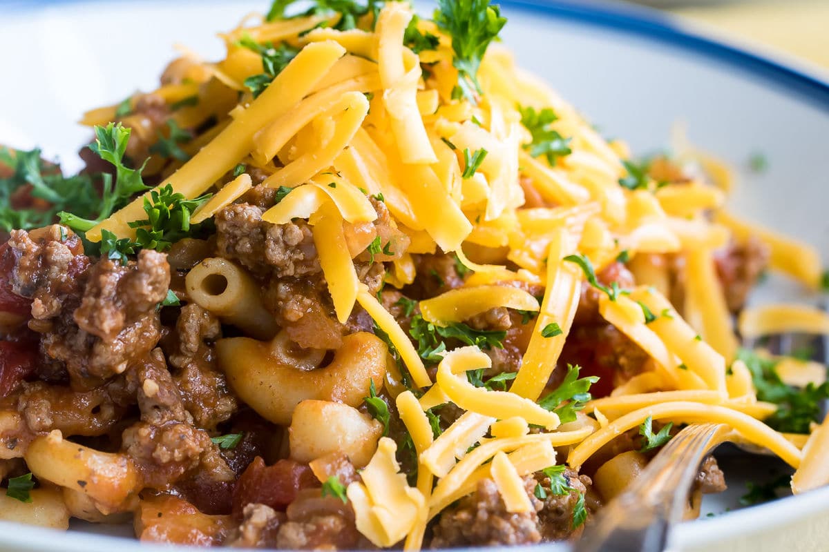 Easy goulash on white plates.