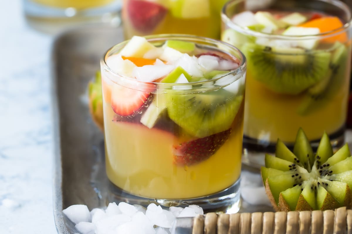 Moscato sangria in glasses on a serving tray.