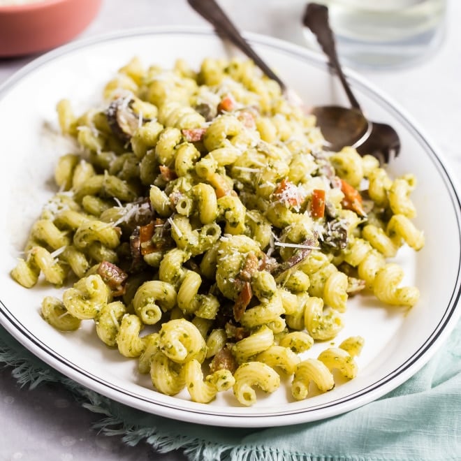 Pesto cavatappi on a white platter.
