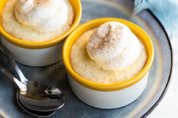Tapicoa pudding in two ramekins on a gray plate.