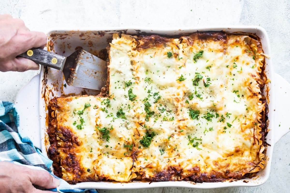 A white baking dish of lasagna.